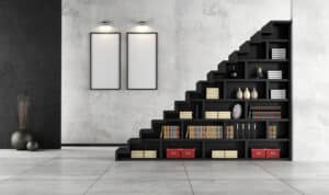 Living Room With Wooden Staircase And Bookcase