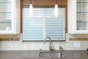 This Silhouette Window Shading offers light control, privacy and a beautiful soft look at this kitchen window.